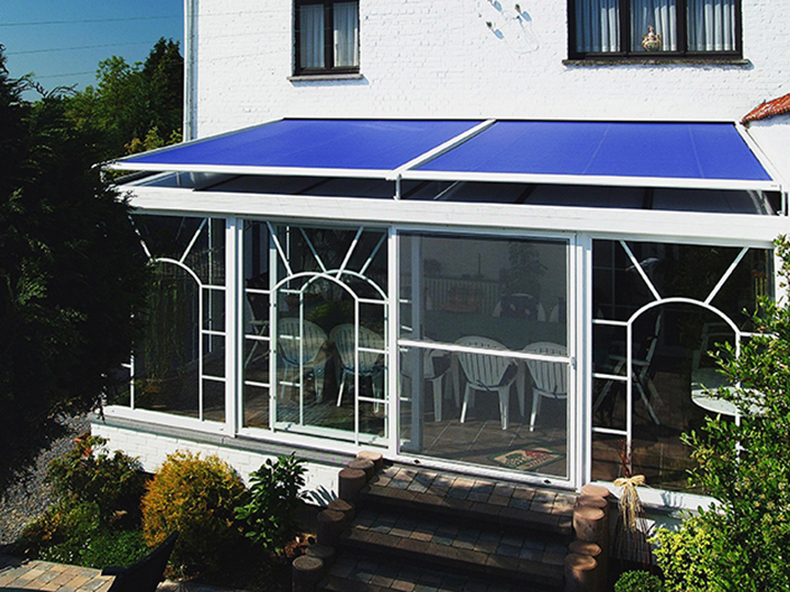 blue conservatory awning over top a small dining area